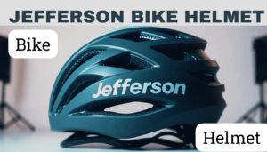 A sleek, modern bike helmet with built-in LED lights and an insurance badge, worn by a cyclist riding on an open road with a city skyline in the background.